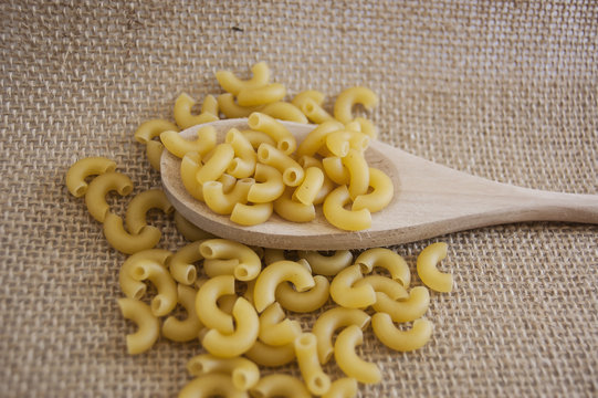 Macaroni is a dry pasta and made of durum wheat, usually no egg. In this picture is an elbow macaroni.