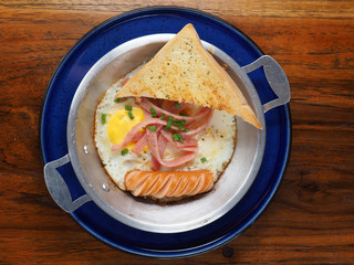 Sunny Side Up with sausage ham and garlic bread