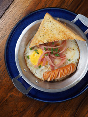 Sunny Side Up with sausage ham and garlic bread