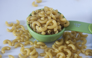 Macaroni is a dry pasta and made of durum wheat, usually no egg. In this picture is an elbow macaroni.