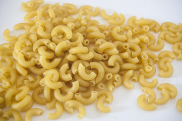 Macaroni is a dry pasta and made of durum wheat, usually no egg. In this picture is an elbow macaroni.