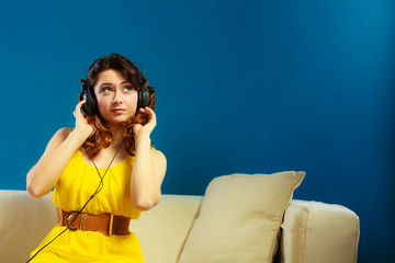 girl in big headphones listening music mp3 relaxing