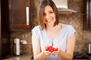 Woman with some raspberries