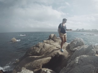 woman walks among the cliff