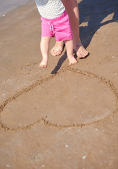 mom and baby on beach  have fun