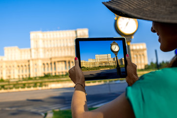 Photographing parliament building in Bucharest