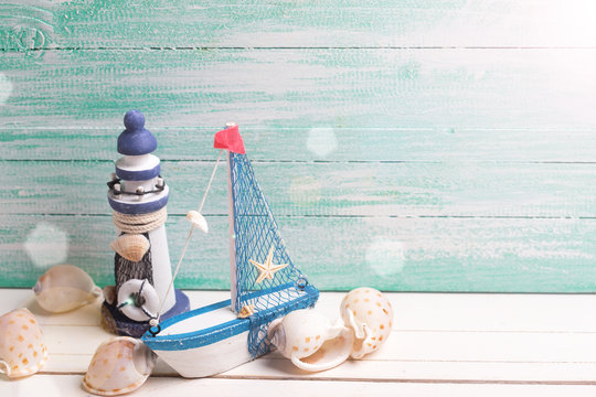 Decorative lighthouse, sailing boat and marine items