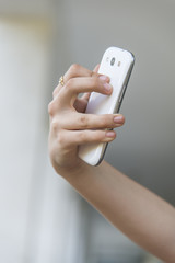 Girl taking a selfie with her phone