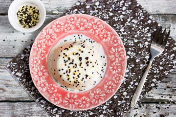 Classical panna cotta with vanilla sauce and chocolate