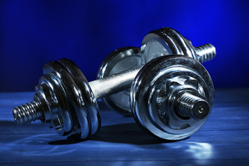 Dumbbells on dark color background