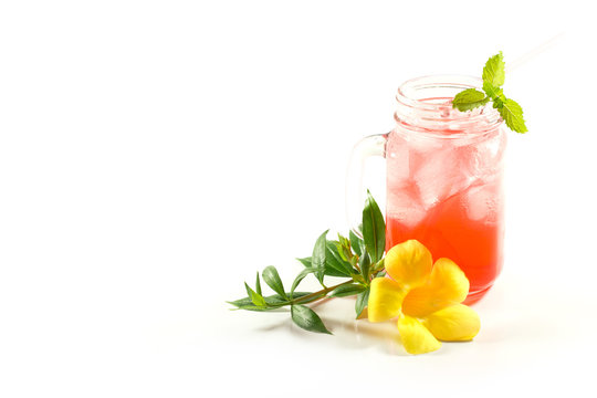 Refreshing summer drinks in jar with ice and mint on a white background