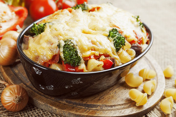 Casserole with meat, pasta, broccoli and tomatoes