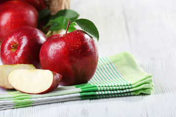 Ripe red apples on table close up