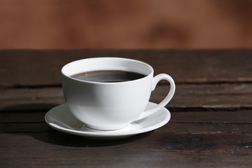 Cup of coffee on blurred background