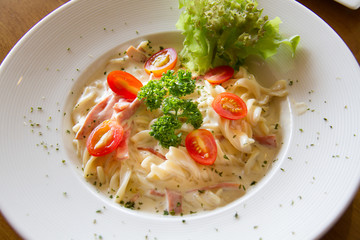 Pasta Carbonara with cherry tomatoes bacon and cheese