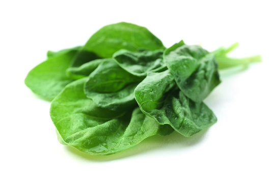 Fresh spinach leaves isolated on white