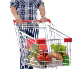 Young man with shopping cart isolated on white