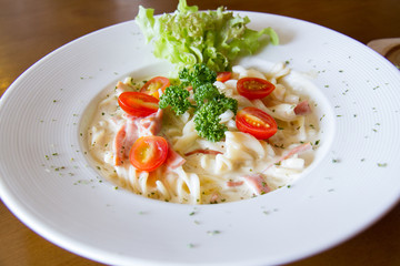 Pasta Carbonara with cherry tomatoes bacon and cheese