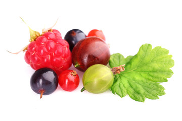 Heap of fresh berries with green leaf isolated on white