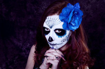 Woman witch with scary makeup.Dia de los muertos