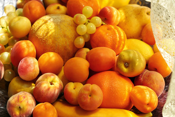 Naklejka na ściany i meble Heap of fresh fruits on tray close up