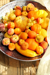 Heap of fresh fruits on tray close up