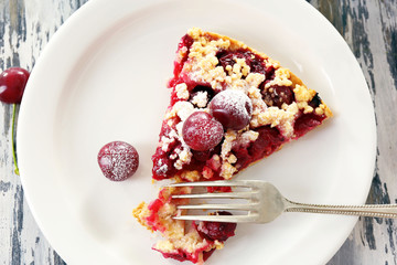Tasty homemade pie with cherries on table close up