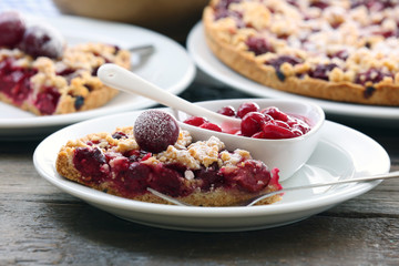 Fototapeta na wymiar Tasty homemade pie with cherries on table close up