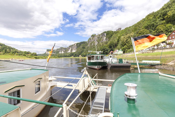 Ferry crossing Elbe river in Rathen, Saxon Switzerland Eastern Ore Mountains, Germany.