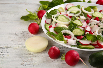 Fresh vegetable salad on table close up