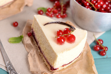 Tasty cheesecake with berries on table close up