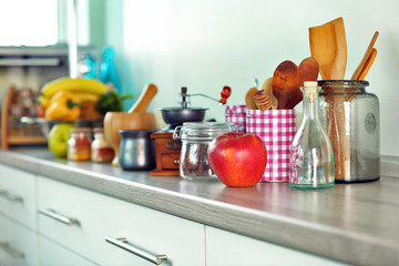 Composition with different utensils on wooden wooden table in kitchen