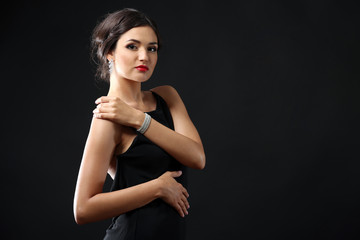 Fototapeta premium Portrait of pretty woman on dark background