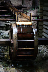 Fototapeta na wymiar Old Wooden water wheel
