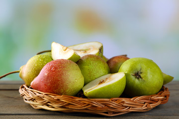 Ripe tasty pears on bright background