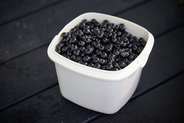 Blackcurrants in a bowl with lots of vitamins.