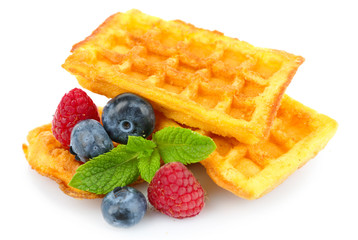 Sweet homemade waffles and fresh berries isolated on white