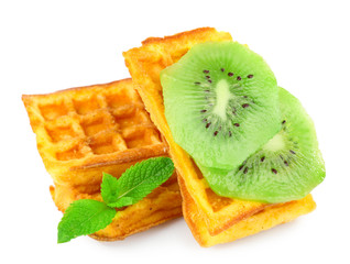 Sweet homemade waffles and fresh fruit isolated on white