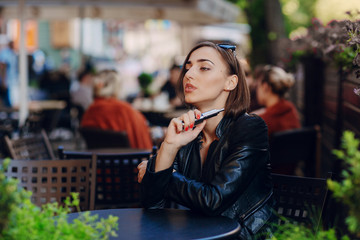 beautiful glamorous brunette smoke electronic cigarette