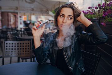 beautiful glamorous brunette smoke electronic cigarette