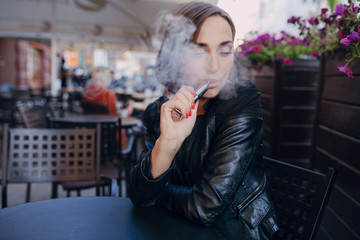 beautiful glamorous brunette smoke electronic cigarette