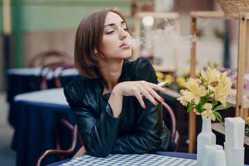 beautiful glamorous brunette smoke electronic cigarette