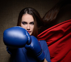 Young pretty woman opening her t-shirt like a superhero. Super g