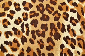 Pink leopard fur pattern. Spotted animal print as background.