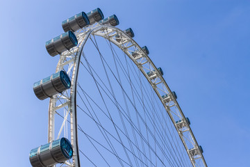 part of Singapore flyer in blue sky