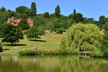 A lake at an English country estate in August,