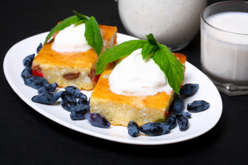 Appetizing cottage cheese casserole with berries and sour cream