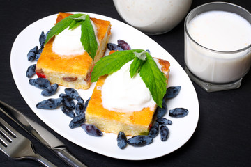 Appetizing cottage cheese casserole with berries and sour cream