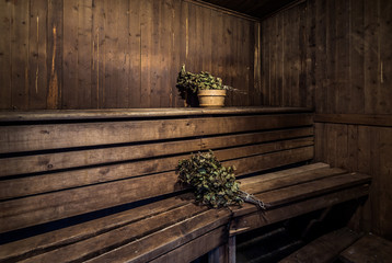 Oak brooms inside of a bath house