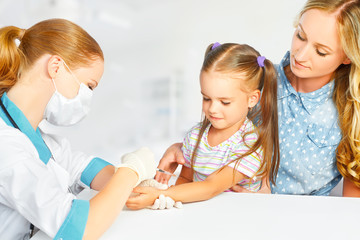 Doctor  pediatrician makes child vaccination
